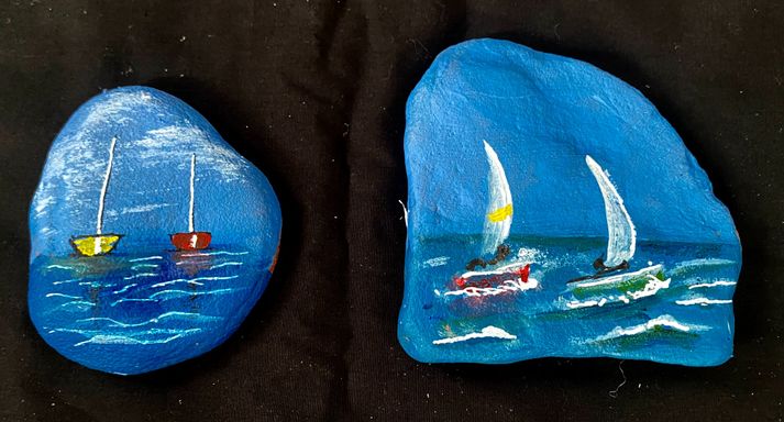 sailboats painted on rocks